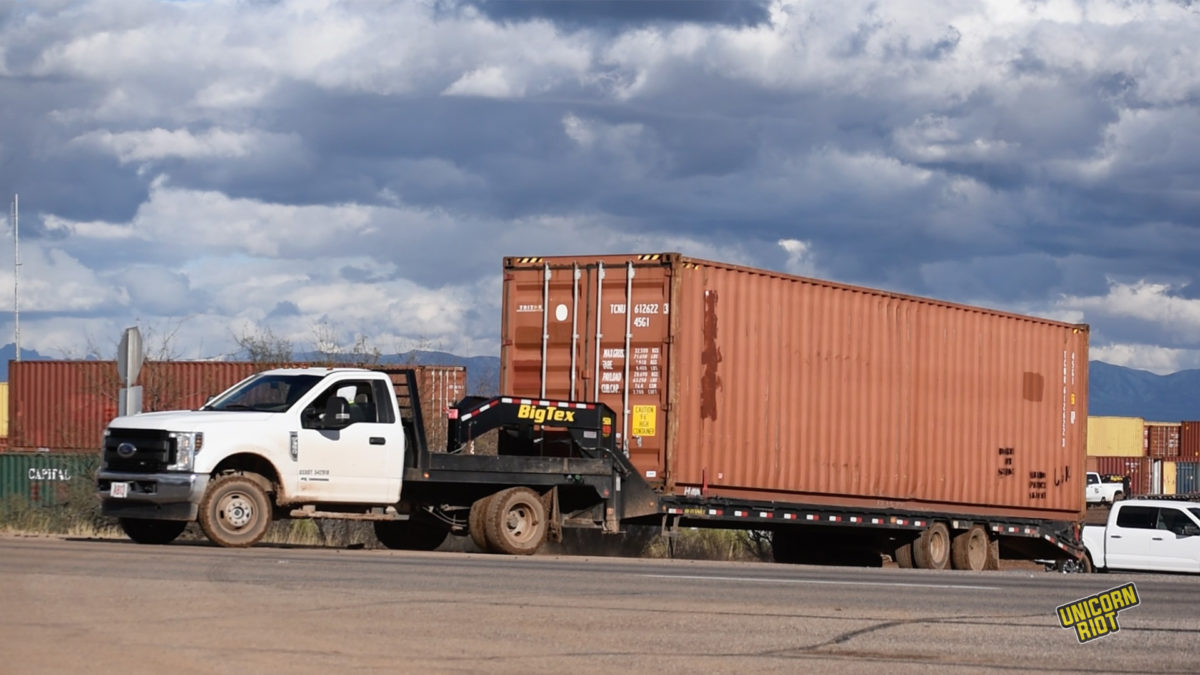 A Quiet Retreat: Hundreds of Shipping Containers Hauled to AZ State Prison as Protests Halt Border Wall