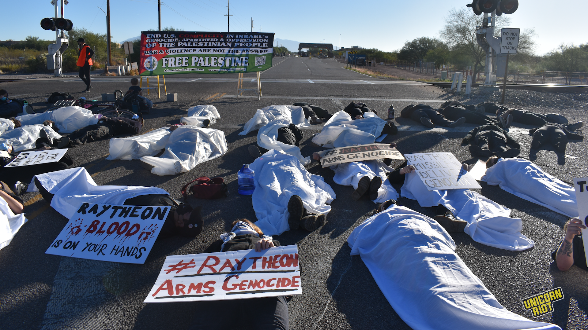 Die-In at Raytheon Compound in Tucson Calls Out Complicity in Gaza